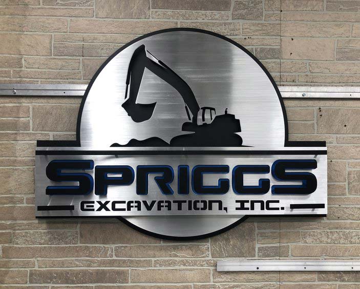 brushed aluminum sign custom built for Spriggs Excavation, Inc.